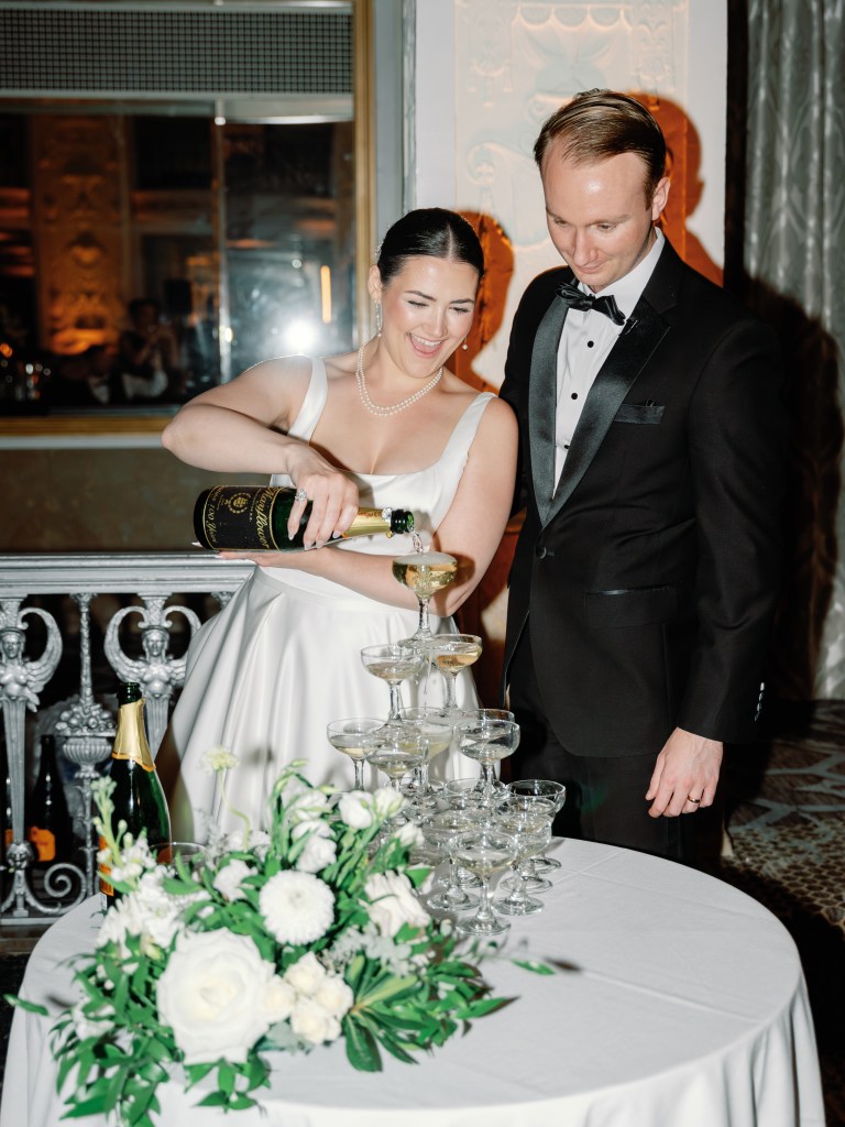 Champagne tower display at a black-tie wedding reception at The Mayflower Hotel