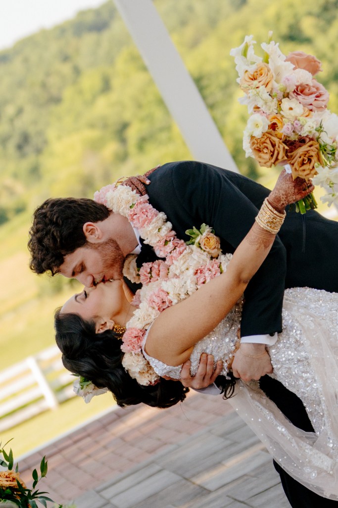 Lush, airy bridal bouquet with garden-style flowers in soft spring tones